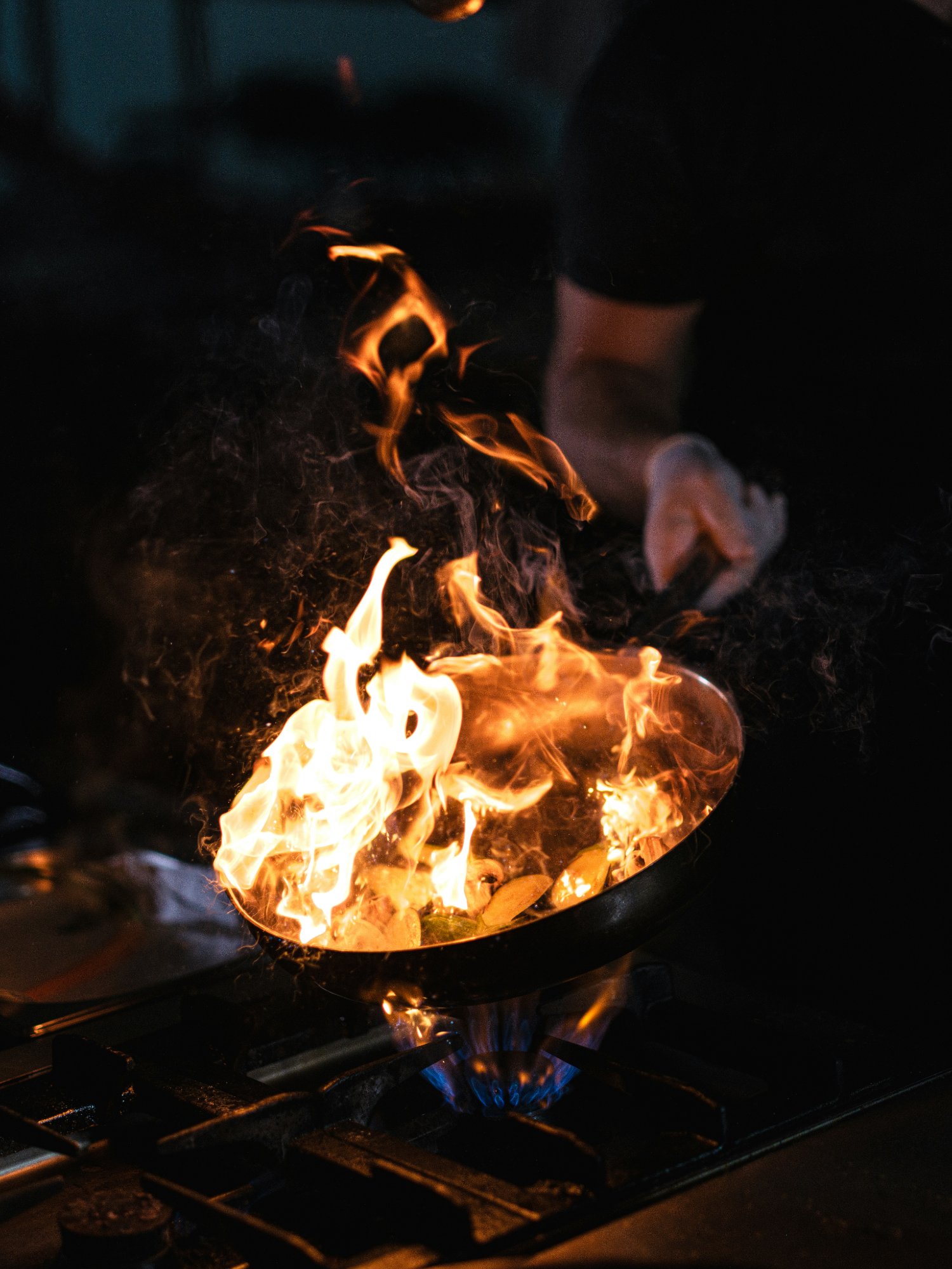 Hibachi chef cooking with flames at Saito's Japanese Steakhouse